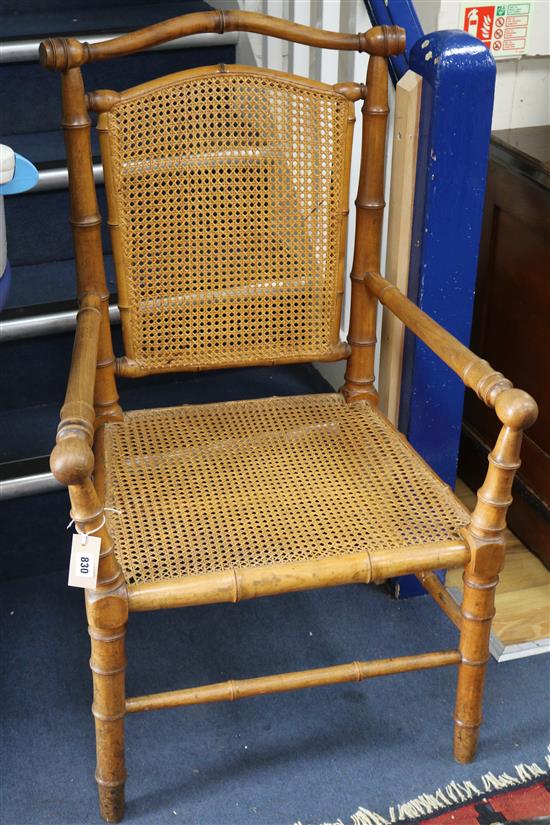 A faux bamboo elbow chair